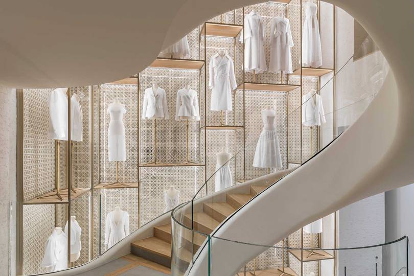 The interior of the new Dior Boutique on the Champs-Élysées, with decorative toiles of key Dior silhouettes Paris Has A Makeover For The 21st-Century Shopper-4